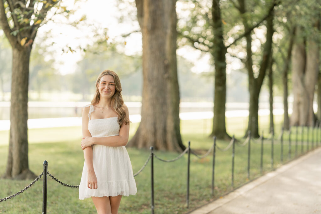 high school girl posing for her senior portraits at the national mall in washington d.c.
