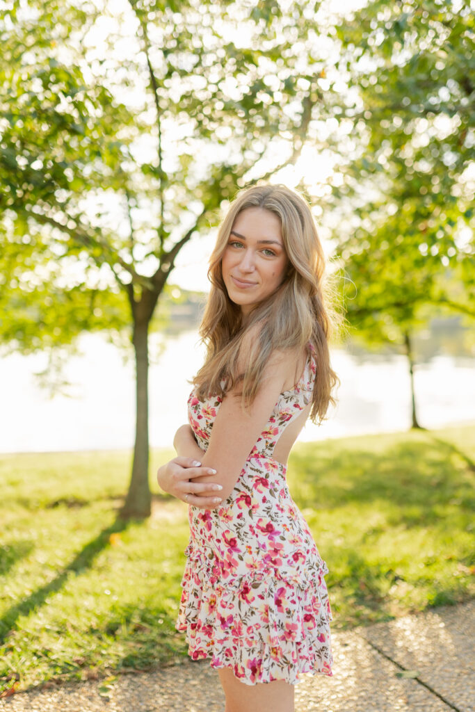 high school girl posing for her senior portraits at the tidal basin in washington d.c.