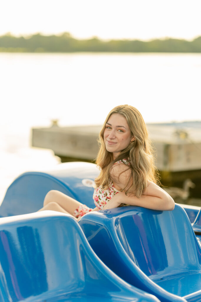 high school girl posing for her senior portraits at the tidal basin in washington d.c.
